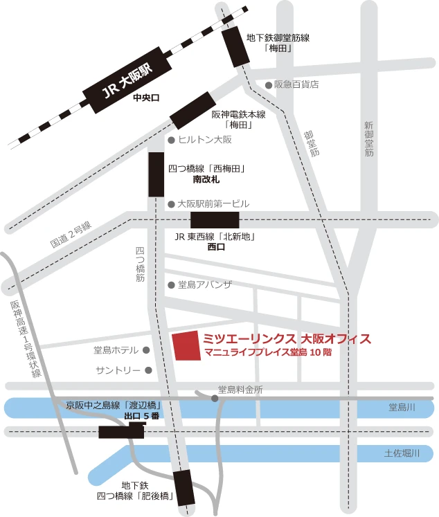 渡辺橋駅の5番出口を出て、渡辺橋南詰の交差点で四つ橋筋を横断。左折し、渡辺橋を渡り70mほど直進すると、右手に12階建てのビル「マニュライフプレイス堂島」があります。